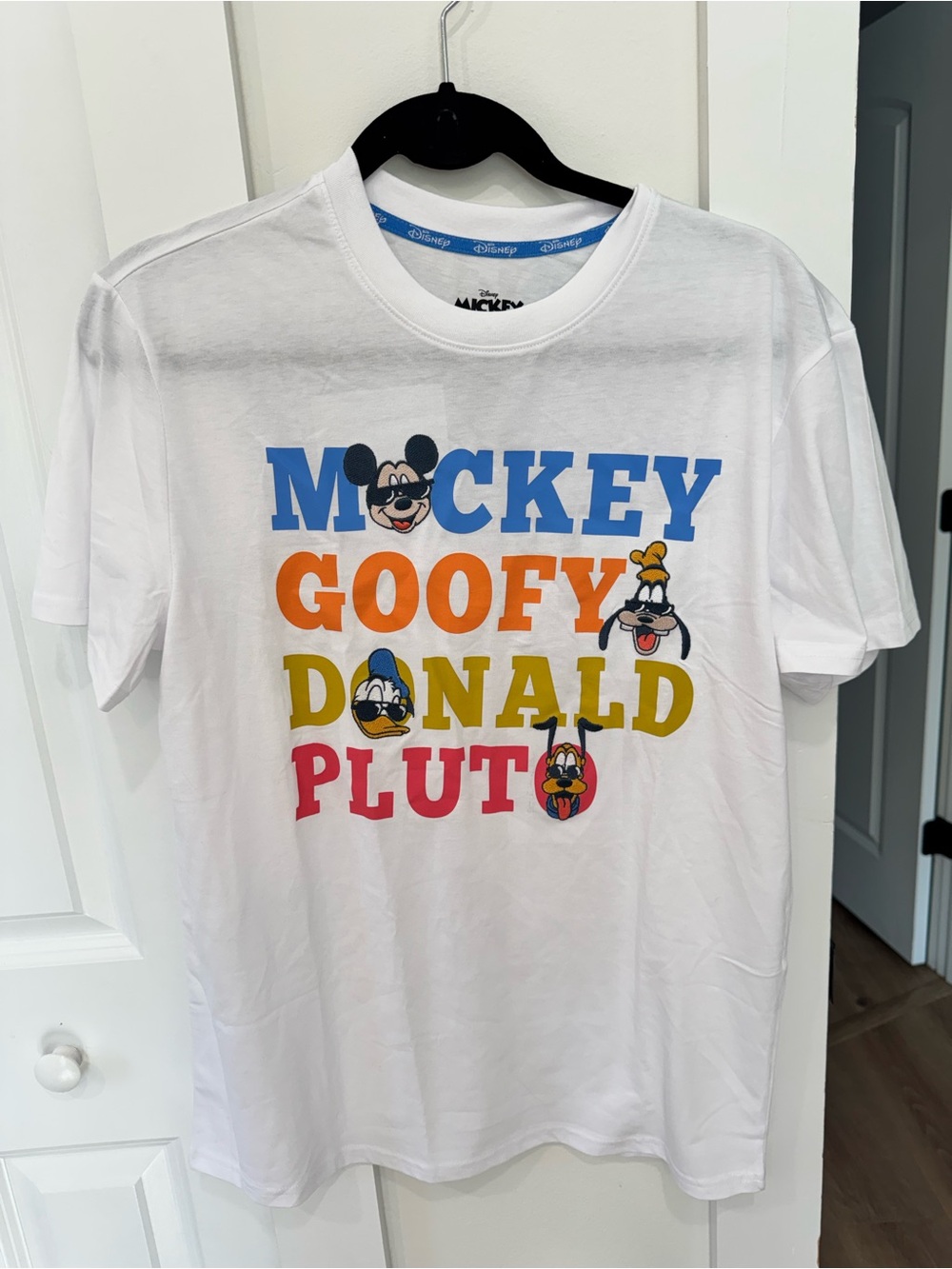 Disney White Graphic Tee with Blue, Orange, Yellow, and Red Lettering